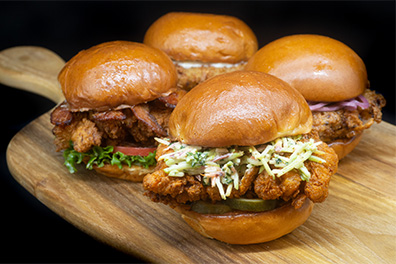 Four fried chicken sandwiches prepared for the best chicken takeout near Barrington, New Jersey.