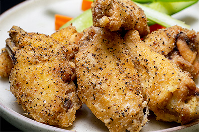 Lemon and Black Pepper Chicken Wings for a patron at our Barrington fried chicken restaurants.