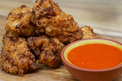 Chicken Bites with dipping sauce from our fried chicken restaurant near Merchantville, NJ.