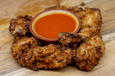 Chicken Tenders and dipping sauce made for Barclay-Kingston, Cherry Hill wings delivery.